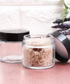 Juvale 24 Pack Clear Round Plastic Jars with Black Lids, 2oz Empty Food Storage Containers for Spice, Powder and Cooking Oil